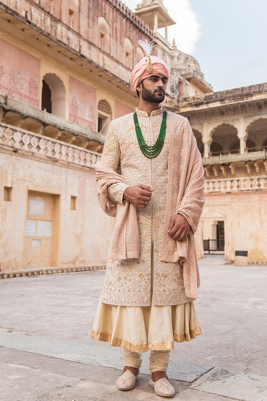 Sherwani Matched With Nude Pink Coloured Stole And Other Accessories